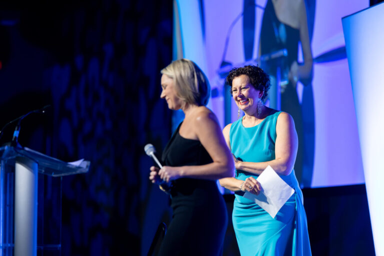 Emcees on stage at the Ronald McDonald House Charities gala, Northern Kentucky Convention Center