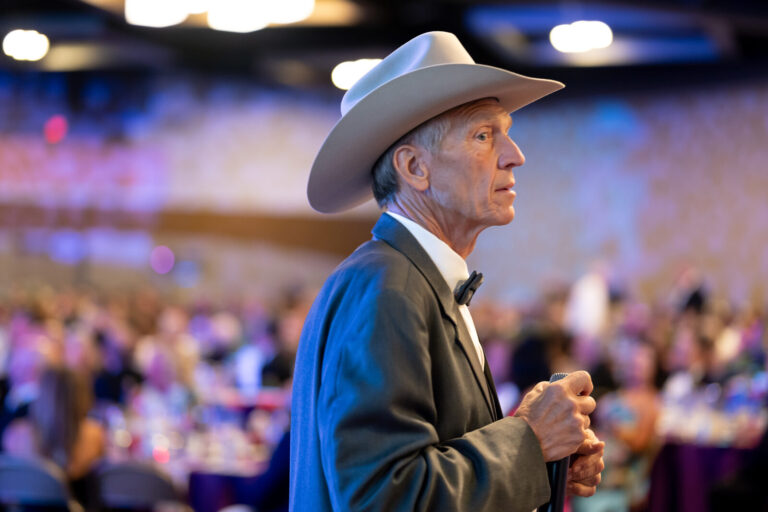 Guest in a cowboy hat in the ballroom crowd at the Ronald McDonald House Charities gala, Northern Kentucky Convention Center