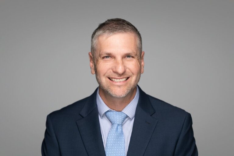 Smiling man in a suit, corporate team headshot – Creative Soul Studios