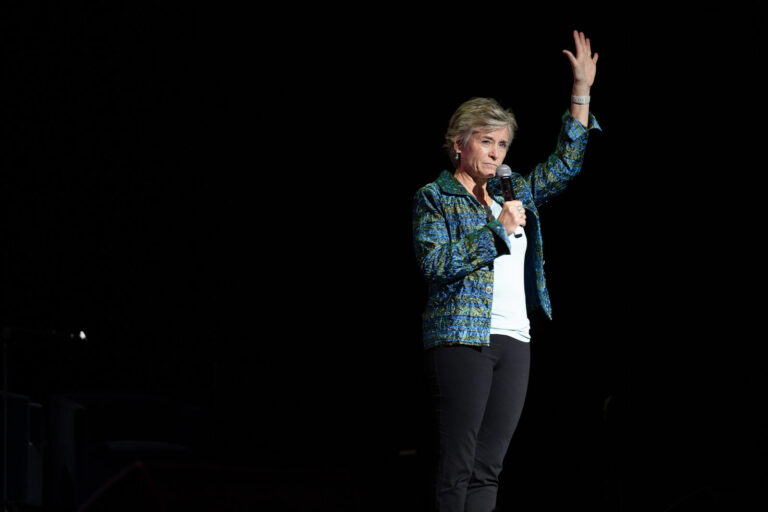 Speaker waving to the audience at the Zeno Group P&G GABLE event, Hard Rock Casino Cincinnati